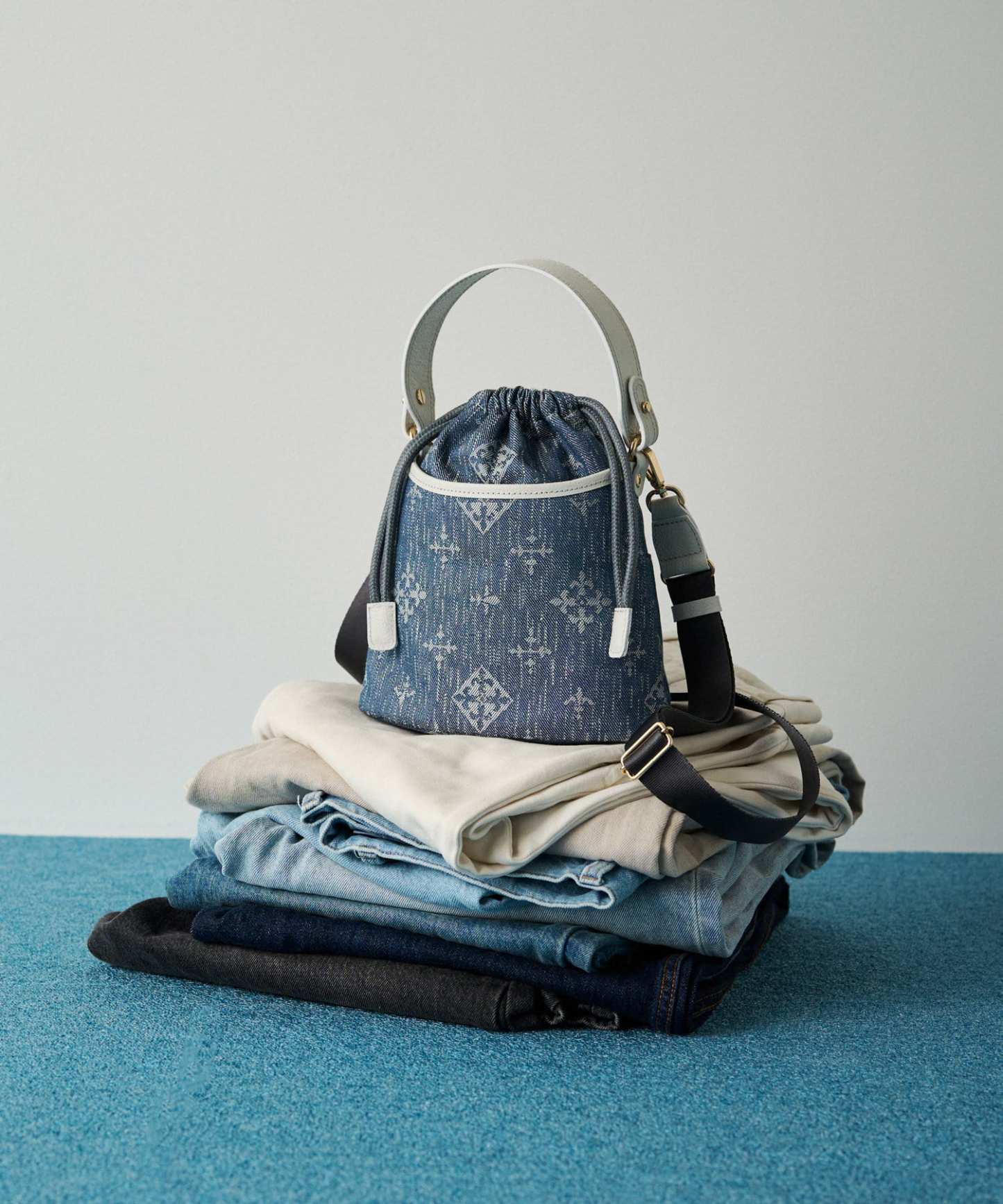Russet [Denim jacquard] 2way drawstring mini shoulder bag Indigo
